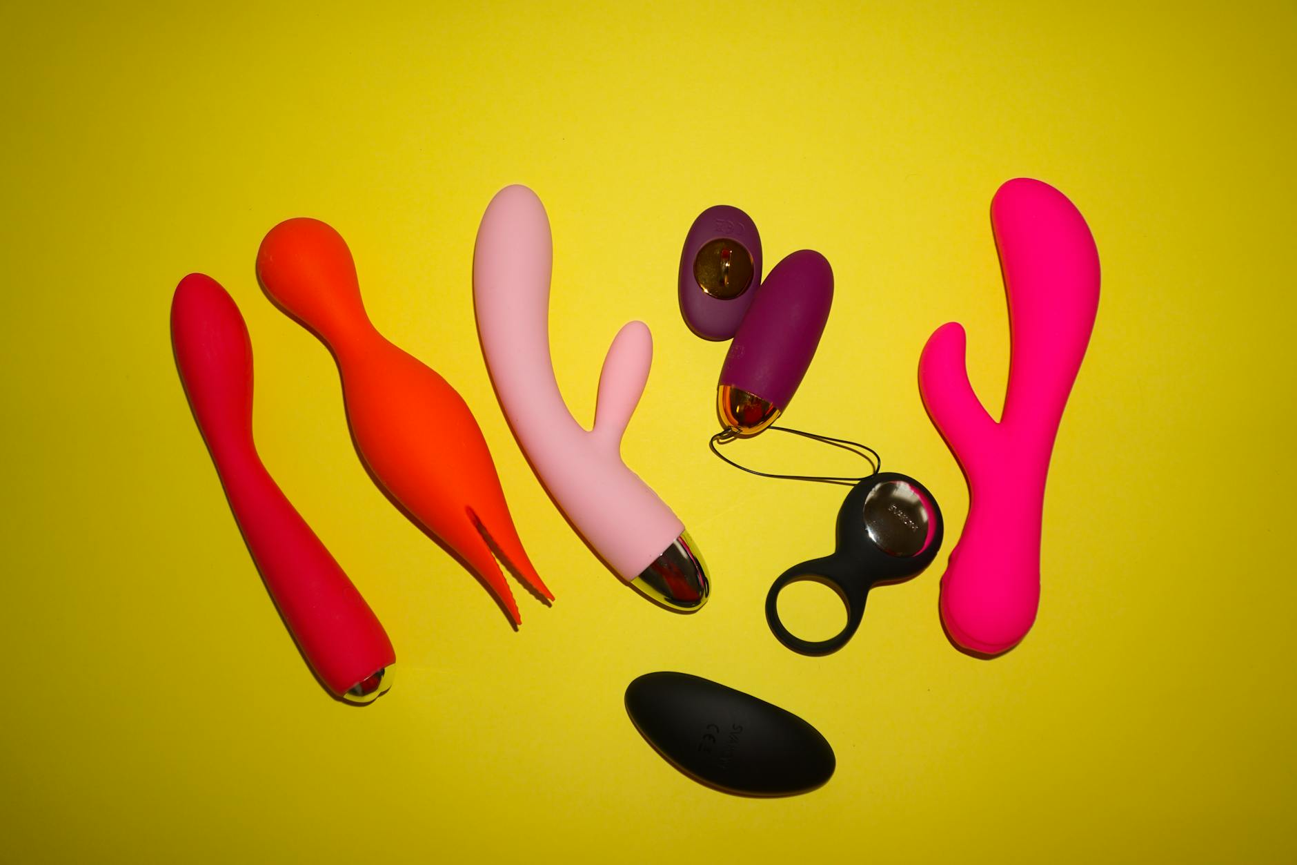 A couple holding a blue vibrator together, representing modern shared intimacy